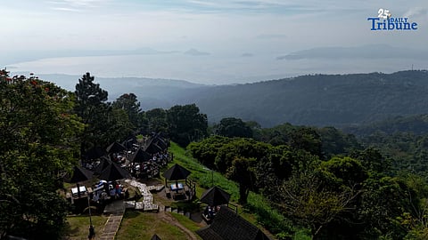 Local tourists enjoy the view of Taal Volcano as it is shrouded in smog at Picnic Grove, one of Tagaytay City’s popular tourist spots, ahead of New Year celebrations on December 30, 2025. Photo by Analy Labor