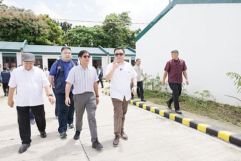 PRESIDENT Ferdinand R. Marcos Jr. inspects newly-completed homes with DHSUD secretary Jose Ramon Aliling and NHA general manager Joeben Tai during the housing turnover at St. Barts Southville Heights in San Pablo City, Laguna on 15 September.