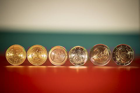 This photograph shows new Euro coins with Bulgarian symbols displayed as Bulgaria's adoption of the euro is set for January 1, 2026, in Sofia on December 30, 2025. Bulgaria prepares to switch to the euro, becoming the 21st eurozone member, amid concerns the move could usher in higher prices and add to political instability rattling the Balkan country.

