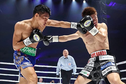 INTERNATIONAL Boxing Federation champion Pedro Taduran (left) batters his way to a savage victory over Ginjiro Shigeoka in their rematch last year in Osaka.   