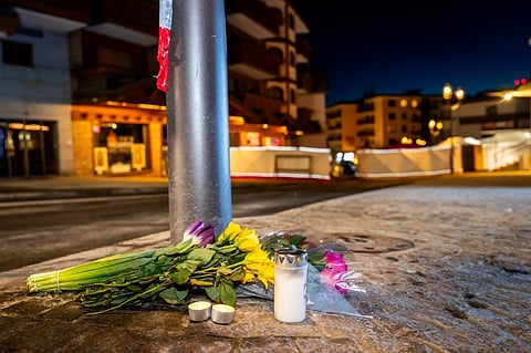 FLOWERS and candles laid on the ground near the site where a fire ripped through a crowded bar in the Alpine ski resort town of Crans-Montana on 1 January 2026. 