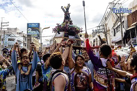 Blessed in passing Along Quezon Boulevard, Catholic devotees lift replicas of the Black Nazarene on Saturday as priests sprinkle holy water, a quiet rehearsal of faith outside Quiapo Church ahead of the Traslacion on 9 January 2026. 