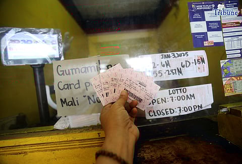 A lotto patron placed his bet at a local Philippine Charity Sweepstakes Office (PCSO) lotto outlet in Quezon City, hoping to win the Grand Lotto 6/55 jackpot, which is expected to reach more than P280 million on Saturday, 03 January 2026.