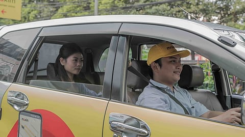 A MAXIM driver transports a passenger during daily operations that support small businesses and partner riders.