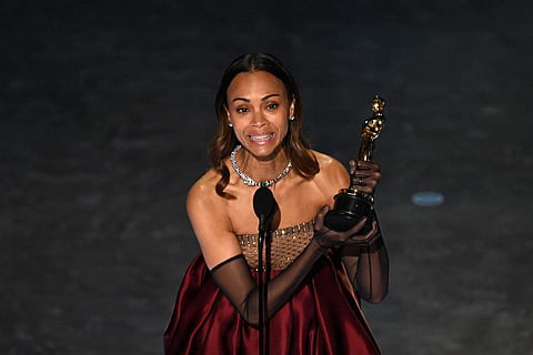 ZOE SALDANA makes history at the 97th Academy Awards, becoming the first American of Dominican origin to win an Oscar, taking Best Supporting Actress for Emilia Perez.
