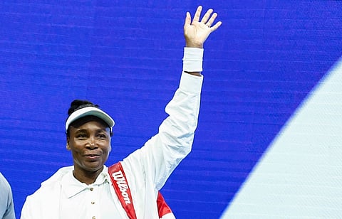 (FILES) USA's Venus Williams waves at supporters after losing against Czech Republic's Karolina Muchova at the end of their women's singles first round tennis match on day two of the US Open tennis tournament at the USTA Billie Jean King National Tennis Center in New York City, on August 25, 2025. Seven-time major singles champion Venus Williams was handed a wildcard to the Australian Open aged 45 on January 2, 2025, becoming the oldest woman ever to play at the season-opening Grand Slam.
