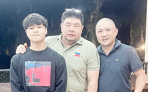 MARTIN Dizon (left) and father Marlon (right) flank JGFP president Oliver Gan after topping the Parent-Child event of the JGFP Mindanao Open at Apo Golf and Country Club in Davao City on Tuesday. 