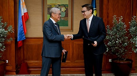 BANGKO Sentral ng Pilipinas Governor and Monetary Board Chairman Eli M. Remolona Jr. (left) shakes the hand of Finance Secretary Frederick Go, after administering’s Go’s oath of office as the newest member of the Monetary Board, in a ceremony held yesterday at the central bank headquarters in Manila.