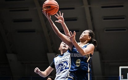 INDAY Sales of National University Nazareth School (right) scores on a layup against Tyler Templo of Ateneo de Manila University in the UAAP Season 88 girls’ basketball at Blue Eagles gym in Quezon City on Sunday (Jan. 11, 2026). The Lady Bullpups won, 155-29.