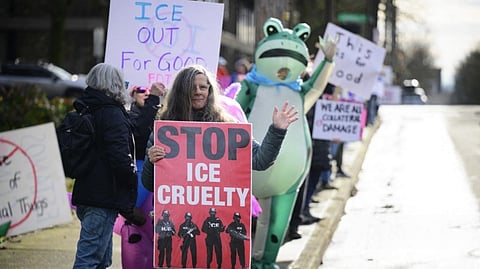 ANTI-IMMIGRATION and Customs Enforcement activists display signs during a protest near Legacy Emanuel Hospital on 10 January 2026 in Portland, Oregon, United States.