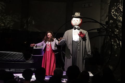 THE final bow — performer and symbolic presence meet under the lights, closing an intimate evening of opera, theater and emotional reckoning.