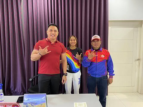 Mayor Jun “Omar” Ebdane poses with SEA Games silver medalist Mariel Abuan and her coach Donald Ermita at the municipal hall in Botolan, Zambales. Abuan is a Filipino national high jumper who recently won a silver medal in the women's high jump event at the 33rd SEA Games in Thailand. 