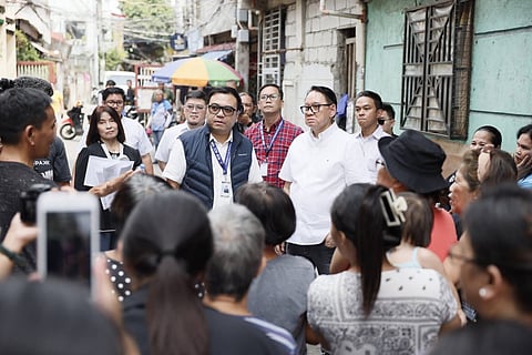 DHSUD Secretary Jose Ramon Aliling joins Valenzuela City residents as they move closer to land ownership following the release of P14 million in ECMP housing funds under the Marcos administration’s expanded 4PH program.