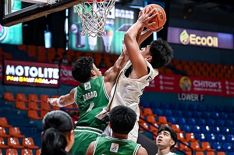 KURL Figueroa muscles his way past Maco Dabao during NUNS’ 60-50 win over DLSZ in the UAAP Season 88 boys’ basketball tournament yesterday at the Filoil EcoOil Centre.