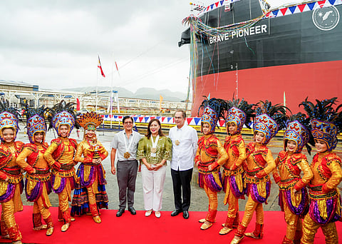 PRESIDENT Ferdinand R. Marcos Jr. (fifth from left), Cebu Governor Pamela Baricuatro and Aboitiz Group president and CEO Sabin Aboitiz, along with tribal dancers in festive gear, led in the naming and delivery of  the world’s first methanol dual-fueled bulk carrier in West Cebu Estates in Balamban, Cebu.