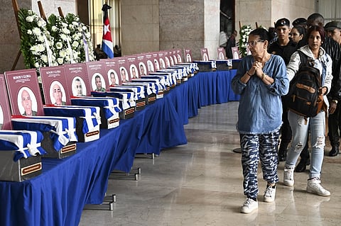 Cubans bid farewell during the funeral honors of the 32 Cuban soldiers who died during the US incursion to capture Venezuelan leader Nicolas Maduro, at the Ministry of the Revolutionary Armed Forces in Havana on January 15, 2026. The capture by US forces of Venezuelan leader Nicolas Maduro on January 3, 2026, and the killing in the operation of 32 Cubans assigned to protect him represent a major blow for the island's revered intelligence services, experts say.