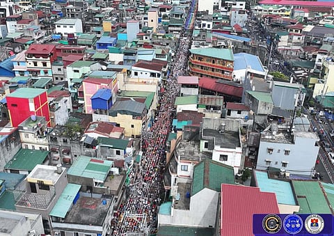 DEVOTEES join the parade for the Feast of the Santo Niño de Tondo in Manila on Sunday. The celebration is known for having the second-oldest image of the Child Jesus in the Philippines, which is believed to have been brought to the country by Miguel López de Legazpi in the 1570s. 