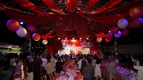 ATTENDEES raise their glasses toward the stage as VinFast gathers media and partners to mark shared progress and outline its direction for 2026 in Manila.
