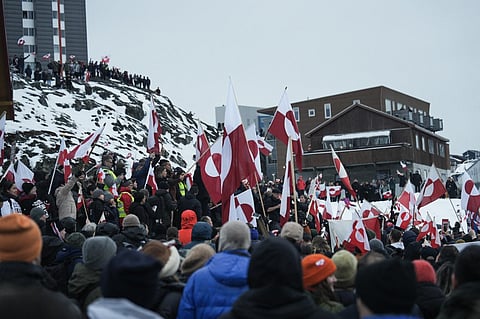 People wave Greenlandic flags during a protest on 17 January 2026  in Nuuk, where thousands rallied against US President Donald Trump’s renewed push to acquire Greenland and threats of steep tariffs on European nations.
