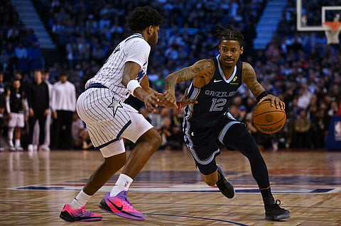 JA Morant attacks with a double-double performance to lead the Memphis Grizzlies to a 126-109 win over the Orlando Magic in the NBA regular season at the O2 Arena in London.   