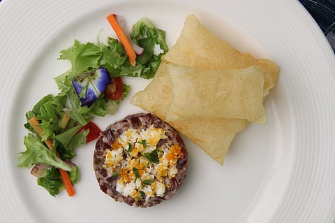 Beef Tartare with Pommes Souffle - Chopped to order hanging tender with smoked paprika and pepper dressing, baguette toast