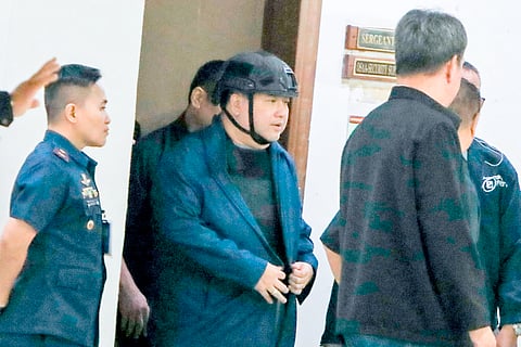 HENRY Alcantara is escorted to a vehicle at the Senate, where he will be transferred to his detention facility at the Department of Justice.