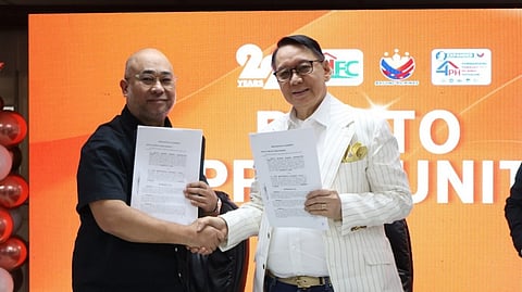 Land Registration Authority  Administrator Atty. Gerardo Sirios and SHFC president and CEO Federico Laxa (right) shake hands after signing a memorandum of agreement expediting land registration and titling process for SHFC’s housing beneficiaries. 