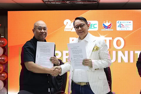 LRA Administrator Atty. Sirios and SHFC President & CEO Laxa (right) shake hands after signing a MOA expediting land registration and titling process for SHFC's housing beneficiaries
