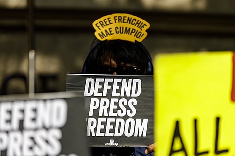 Press freedom advocates hold a protest outside the Department of Justice building in Manila on Wednesday, 21 January 2026, calling anew for the release of detained journalist Frenchie Mae Cumpio as Tacloban City regional trial court branch 45 is set to issue a verdict on her trial on Thursday, 22 January.

Cumpio, a community investigate journalist for news site Eastern Vista, was arrested in 2020 along with four others during a raid by the authorities in their office in Tacloban City. They are facing charges of illegal possession of firearms and explosives and financing terrorism.