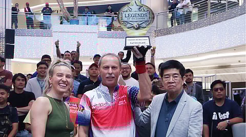 EARL Strickland lifts the trophy after beating Francisco ‘Django’ Bustamante, 11-6, in the WNT Legends event on Friday at Gateway Mall in Cubao.