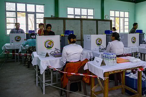 VOTERS cast their ballots at a polling station during the third and final phase of Myanmar's general election in Mandalay on 25 January 2026. 