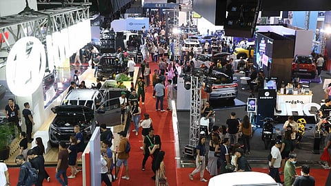 CROWDS fill the show floor as visitors walk through vehicle displays and brand booths during a previous Manila International Auto Show at the World Trade Center Metro Manila.