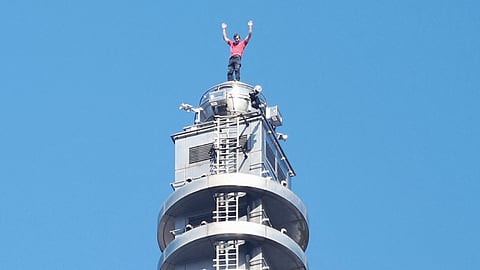 AMERICAN rock climber Alex Honnold raises his arms from the top of the Taipei 101 building after he successfully free soloed the landmark skyscraper without ropes or safety gear in Taipei on 25 January 2026. 