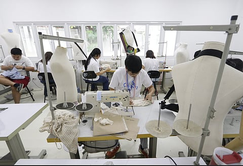 THE participants of COSLAB2 work on their designs under the guidance of Gino Gonzales.