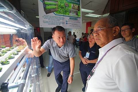 Sanyo Denki Philippines Inc. President and CEO Hirokazu Takeuchi explain to SBMA Chairman and Administrator Eduardo Jose L. Aliño the Hydroponic System unit the company donated to the government agency at Building 255 in Subic Bay Freeport Zone. 