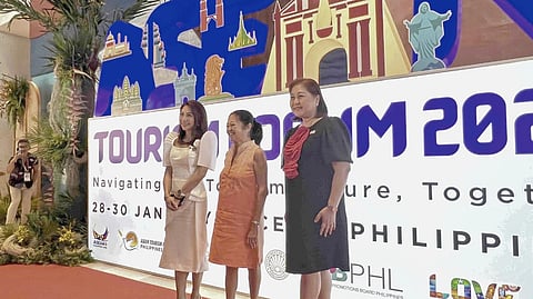 FIRST Lady Liza Araneta-Marcos (center) graces the opening of the ASEAN Tourism Forum on Wednesday, welcomed by Tourism Secretary Christina Garcia Frasco (left) and Lapu-Lapu City Mayor Cindi King-Chan at the Mactan Expo, Lapu-Lapu City.
