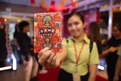 A participant shows off the exclusive Game, Sinulog! Passport.
