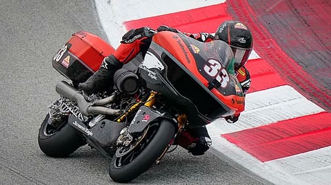 RIDER leans a Harley-Davidson bagger into a corner during on-track action from the Bagger World Cup grid.