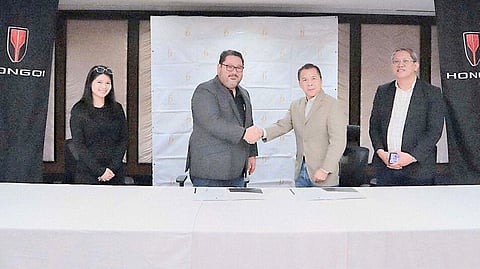 SEALING the partnership with a ceremonial handshake during the signing are the officials and executives of Hongqi and The Bellevue Manila. Shown are (from left): Justine Delacerna, assistant director for Group Marketing of The Bellevue Manila; John Patrick Chan, managing director of The Bellevue Manila; David Zaballero, vice president and general manager of Hongqi Philippines; and Brian Badilla, sales and marketing head of Hongqi Philippines.