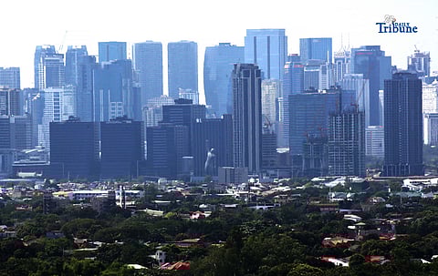 (February 03 2026) A 180 ft. statue of Victor and the high-rise buildings in Ortigas Center, seen from Antipolo City on Tuesday February 3 2026. The statue depicts a man with one arm raised as if it is celebrating a victory. Photo/Analy Labor
