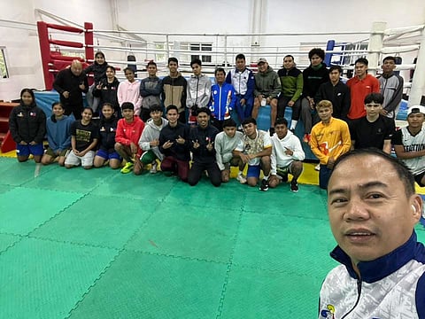 NATIONAL boxing team coach Roel Velasco presides over the training at Teacher’s Camp in Baguio City.