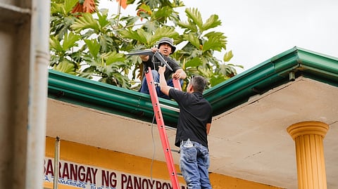 PERSONNEL of a telco provider in Barangay Panoypoyan, Camarines Sur, connect an Internet router on the roof. Internet signal will soon be more reliable in the said province, as PLDT Enterprise said Starlink is now being used by the Camarines Sur government and SMS Global Technologies Inc., providing critical connectivity for local communities, education, healthcare and disaster response. PLDT is the first and only telecom unit in the country to be an authorized Starlink reseller.