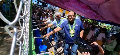 ICTSI Foundation and Bloomberry Cultural Foundation executive director Filipina Laurena (3rd from right, partly hidden) claps her hand as Manila Water Foundation executive director Reginald Andal (right), Pilipinas Shell Foundation Inc. executive director Sebastian C. Quiñones Jr. (2nd from right), and other officials turn the taps of the newly-installed deep well for the Aeta community in Sitio Burog, Bamban, Tarlac. 