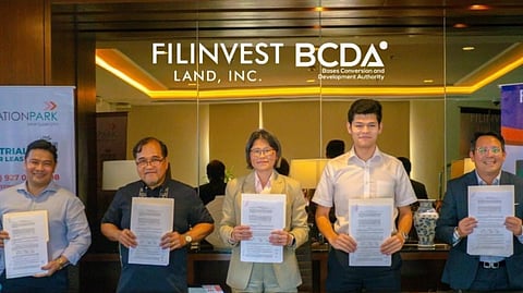 AT the signing of the lease agreement between interconnectivity solutions provider EDAC Group and Filinvest Innovation Park — New Clark City chosen by the former as the site of its newest manufacturing facility are (from left) Carmelo Centeno III (General Manager, FIP New Clark City), Francis Ceballos (SVP, Filinvest Land), Connie Robinson (Financial Director, EDAC Philippines Inc.), Sherwin Robinson (Director of Operations, EDAC Philippines Inc.), and Kenneth Peralta (Vice President, BCDA).