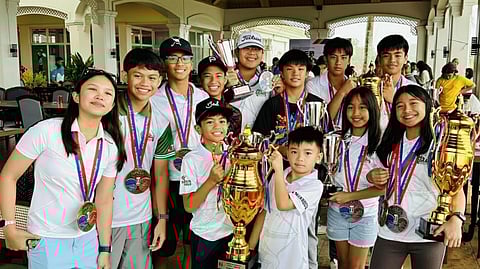 MEMBERS of De La Salle University-Laguna show off the trophies they hauled at the close of Division 3 of the JGFP Interschool tournament.