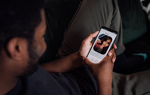 A MAN using a dating app.