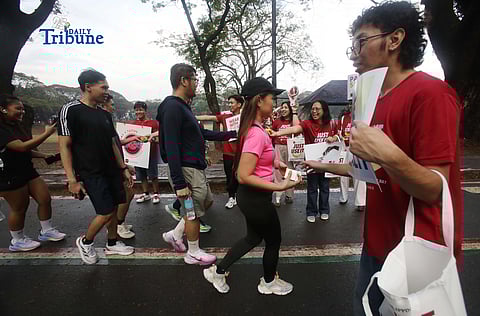The AIDS Healthcare Foundation, in partnership with youth group PANTAY, handed out free condoms and roses to early morning joggers at University of the Philippines Diliman on Saturday, Feb. 14, 2026.

The giveaway marked Valentine’s Day and followed the observance of International Condom Day on Feb. 13. In June 2025, the Philippines Department of Health declared the HIV/AIDS crisis a public health emergency after a 500% rise in infections among 15- to 25-year-olds.