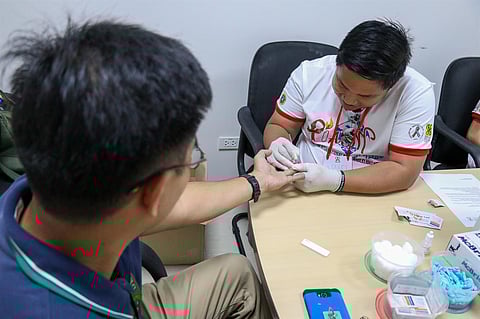 A patient undergoing HIV testing through one of the country's DOH-designated HIV testing facilities in Iloilo.