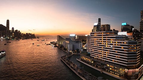 REGENT Hong Kong’s exterior along Victoria Harbour at sunset, showcasing its prime waterfront setting against the city’s iconic skyline.