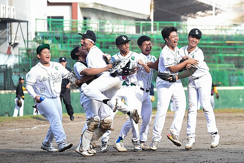 THE De La Salle Zobel Junior Green Batters celebrate after eking out a 4-3 win over the NUNS Bullpups to advance to the finals of the UAAP Season 88 high school baseball tournament.    
